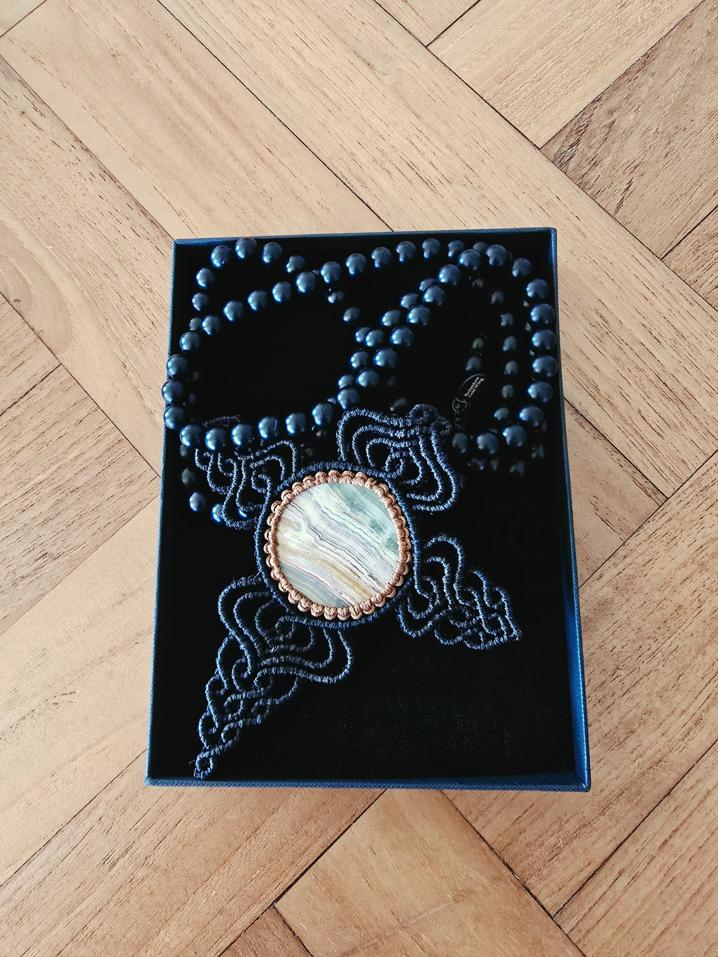 Gold Wing Cross Pendant with Round Stone Named by Poet
